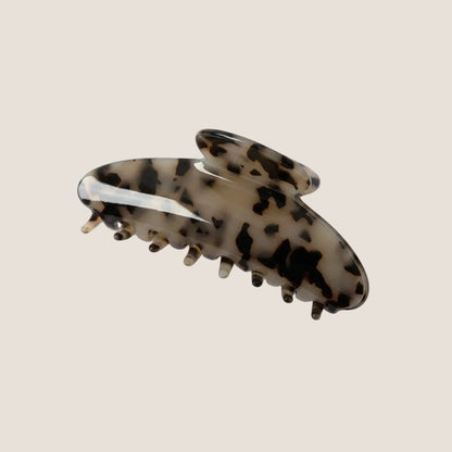 Tortoiseshell patterned hair clip on a white background