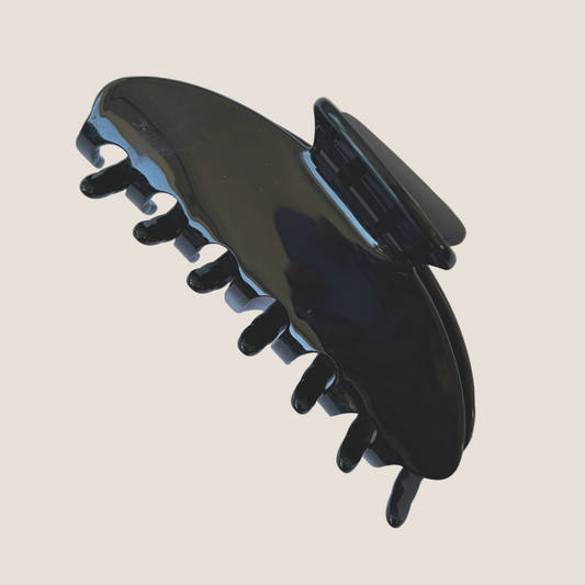 Black hair clip on a white background