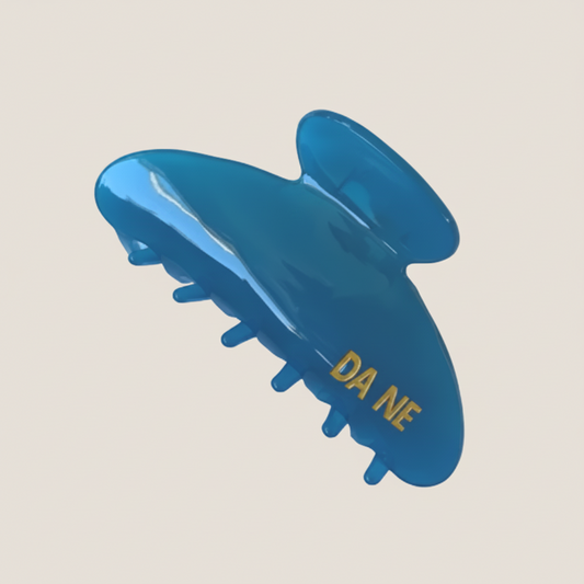 Blue hair claw with 'DA NE' branding on a white background