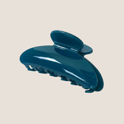 Blue hair clip on a white background