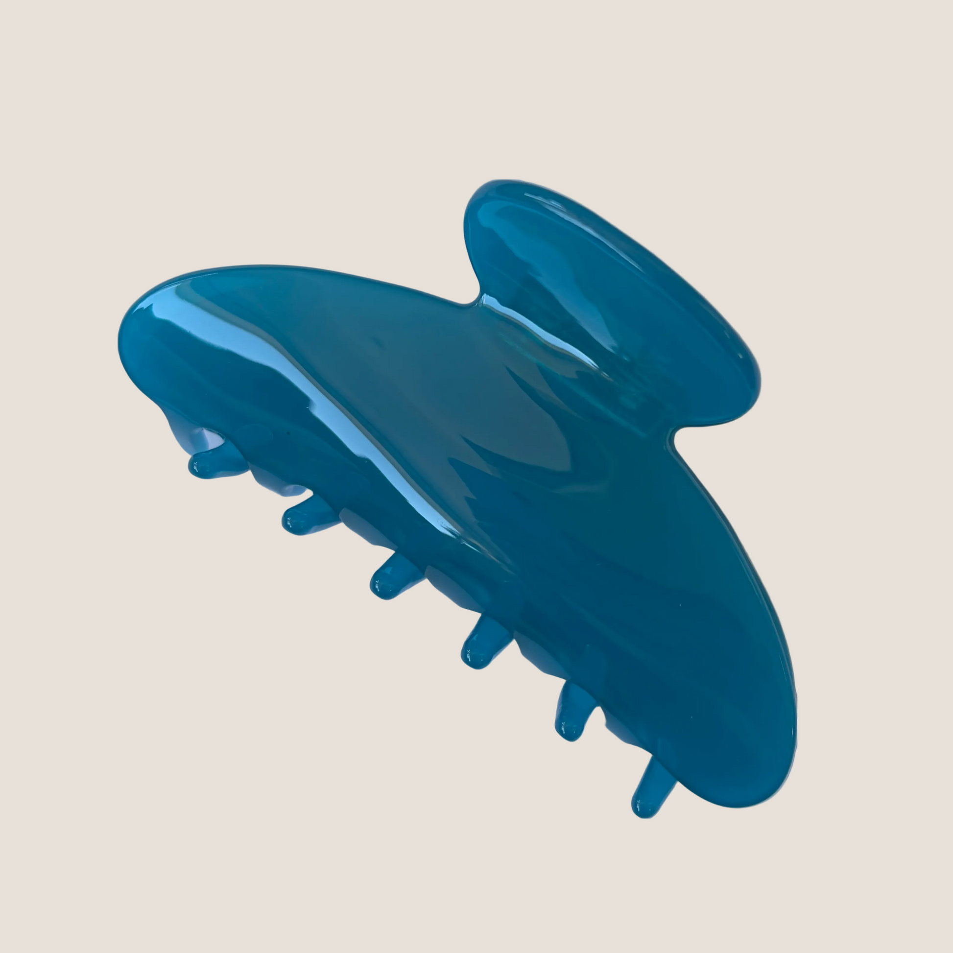 Blue hair clip on a white background